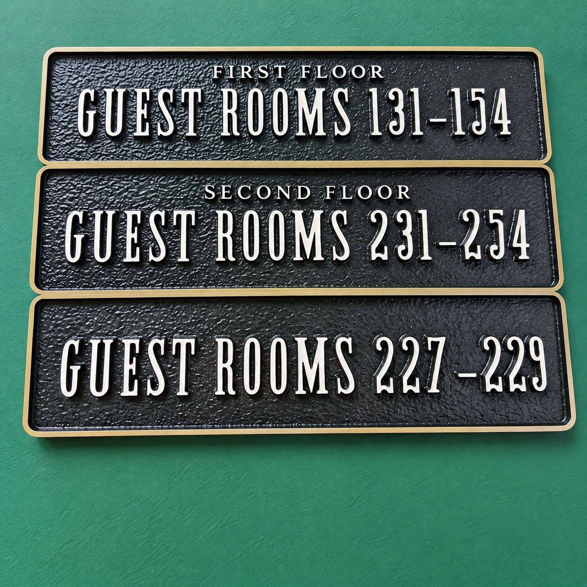 LC · Custom Metal Relief Door Plaques