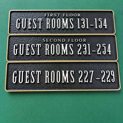 LC · Custom Metal Relief Door Plaques